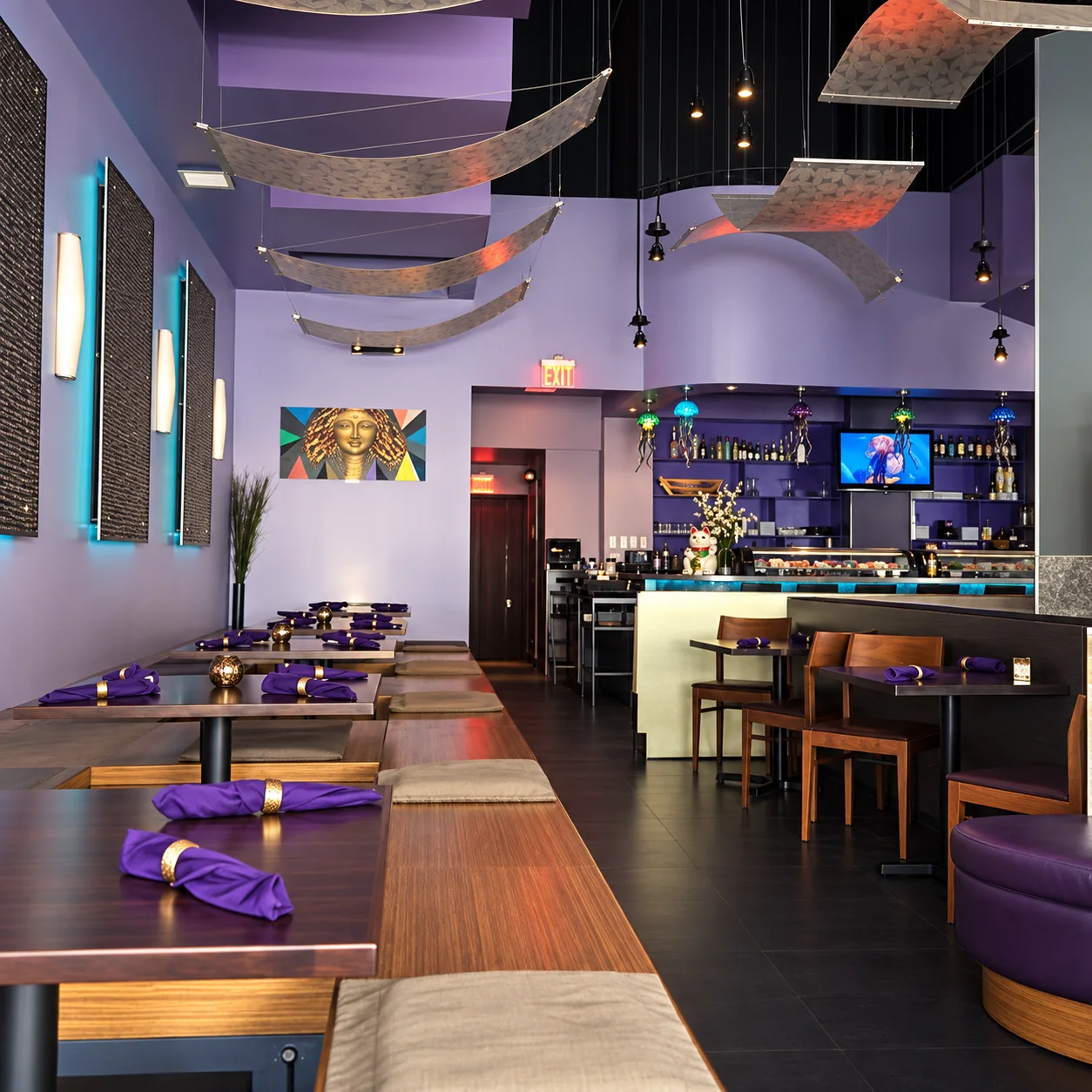 Tee Jays Thai Sushi dining room with purple walls, sculptural ceiling panels and sushi bar